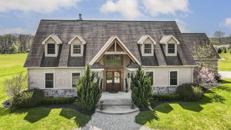 BEAUTIFUL ESTATE AND HORSE FARM ON 29+ ACRES | Stunning custom-built Granville home on 29 acres with horse farm.