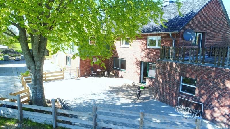 Renovated farm with horse stable and riding arena.