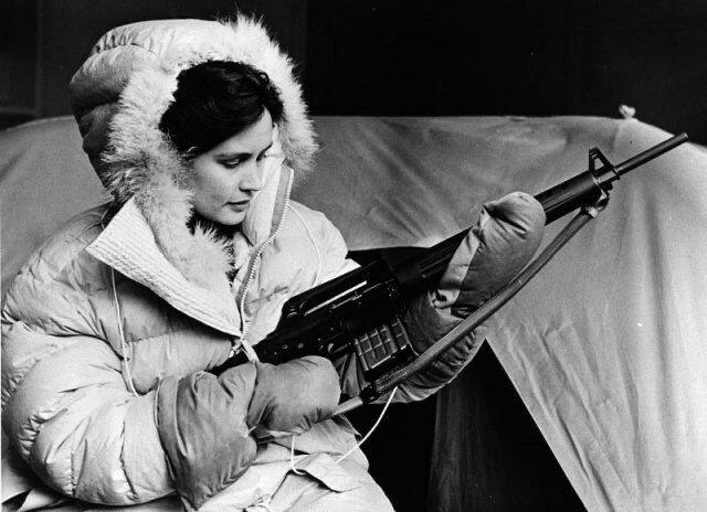 How can a  young lady protect you in case of a polar bear attack?