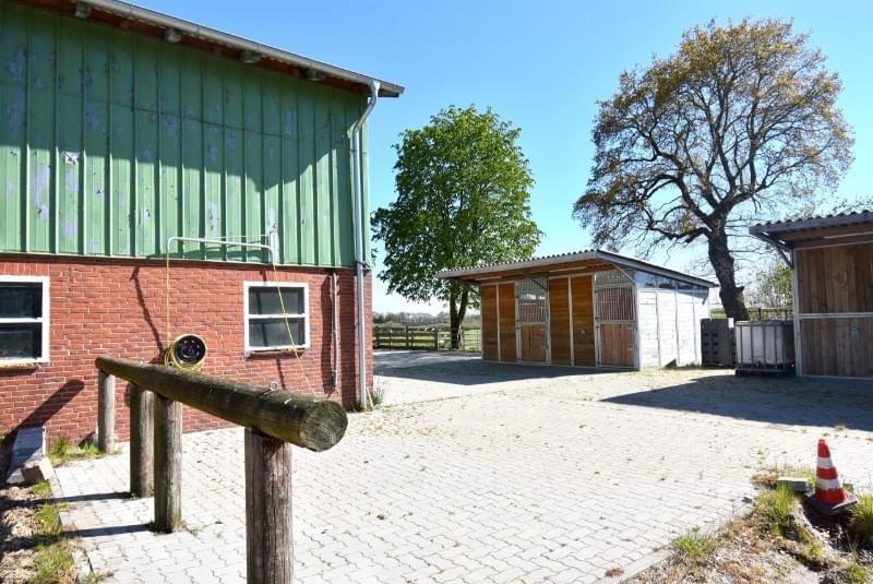 Renovated farm with horse stable and riding arena.