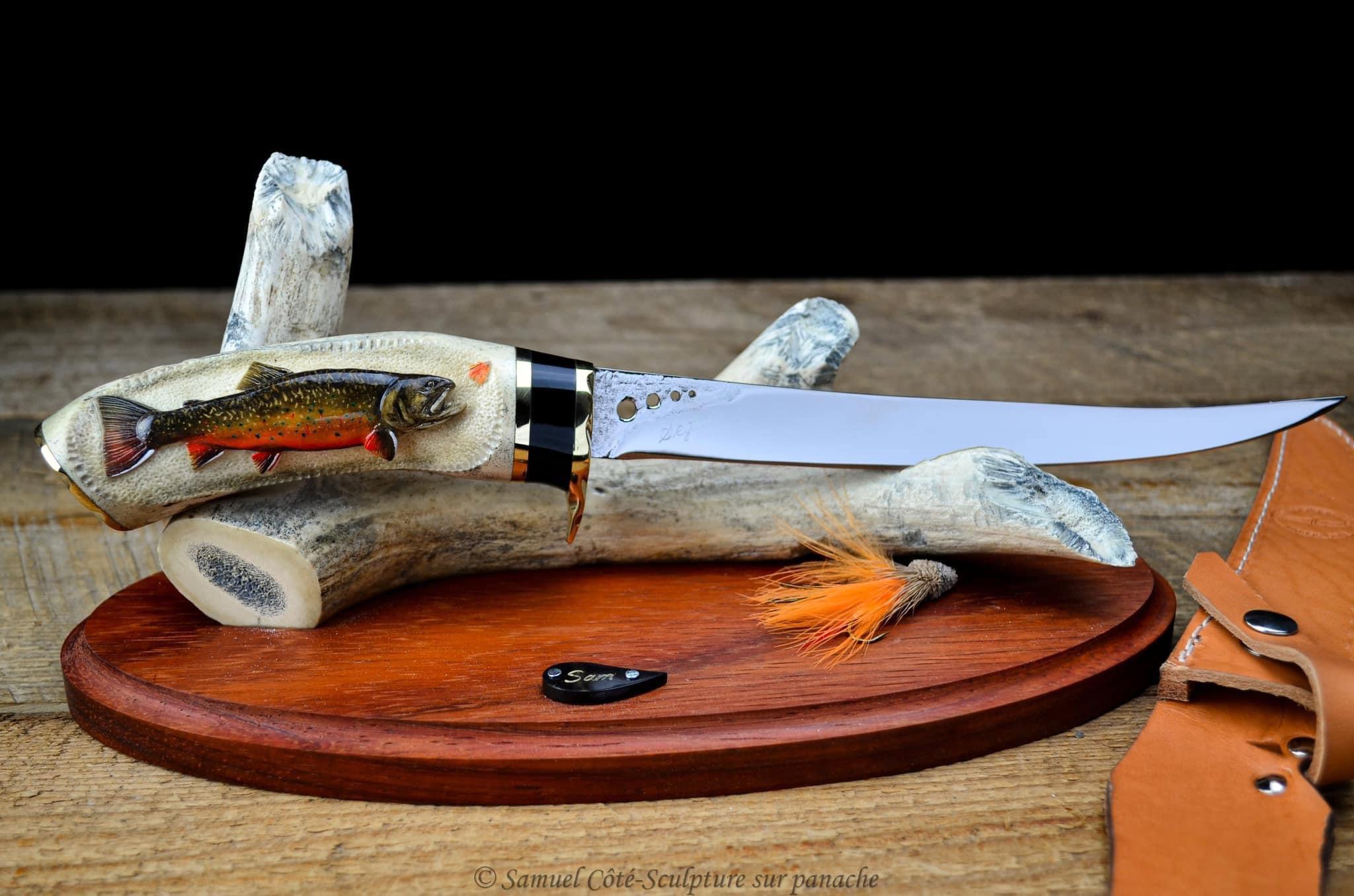 Just finished this piece with a brook trout carved on the antler made of moose antler.