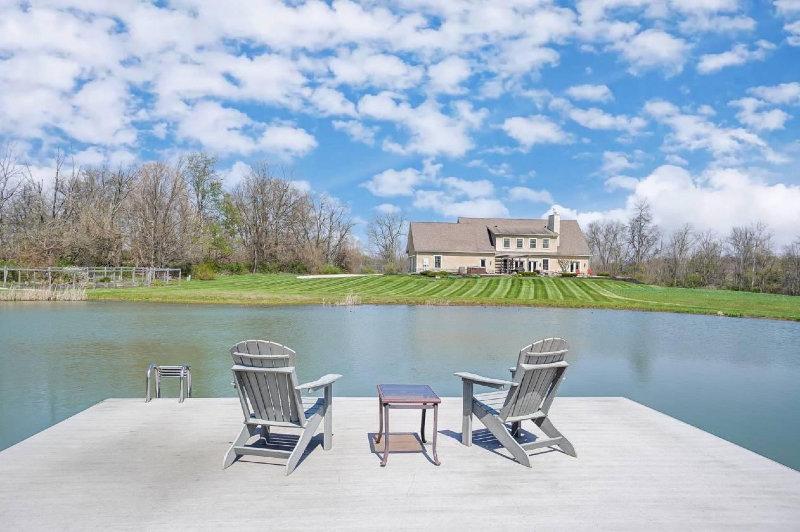 BEAUTIFUL ESTATE AND HORSE FARM ON 29+ ACRES | Stunning custom-built Granville home on 29 acres with horse farm.